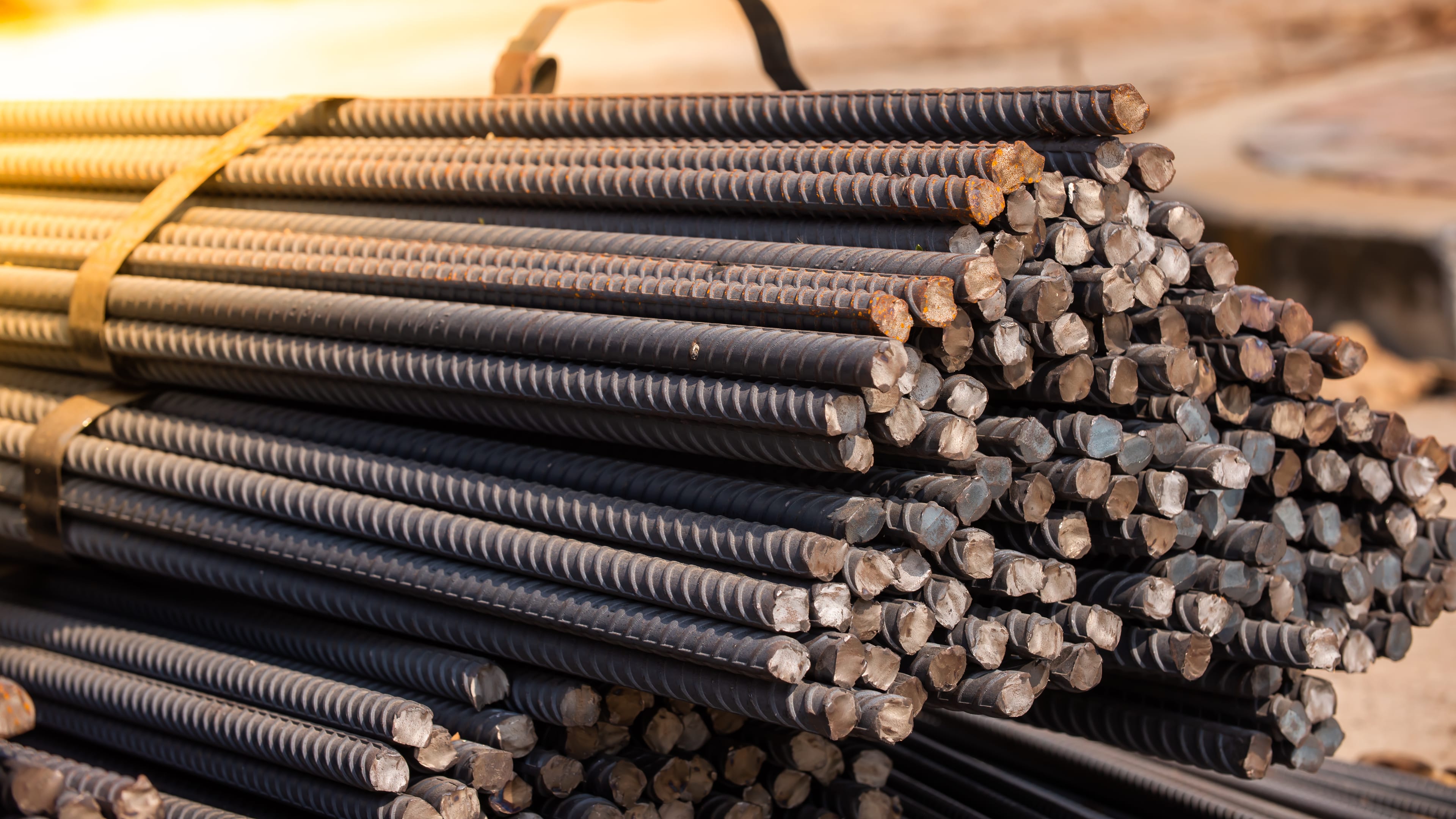 Bundled steel rebar staged in a materials yard